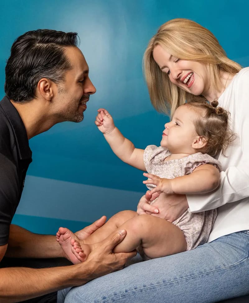 A licensed chiropractor delivering a gentle hands-on adjustment to a patient